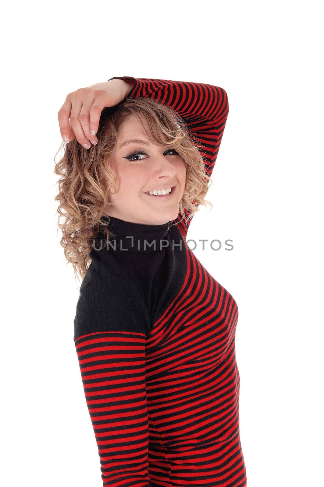 A young Caucasian slim woman in a  striped red and black dress .standing in profile waist up, isolated for white background..