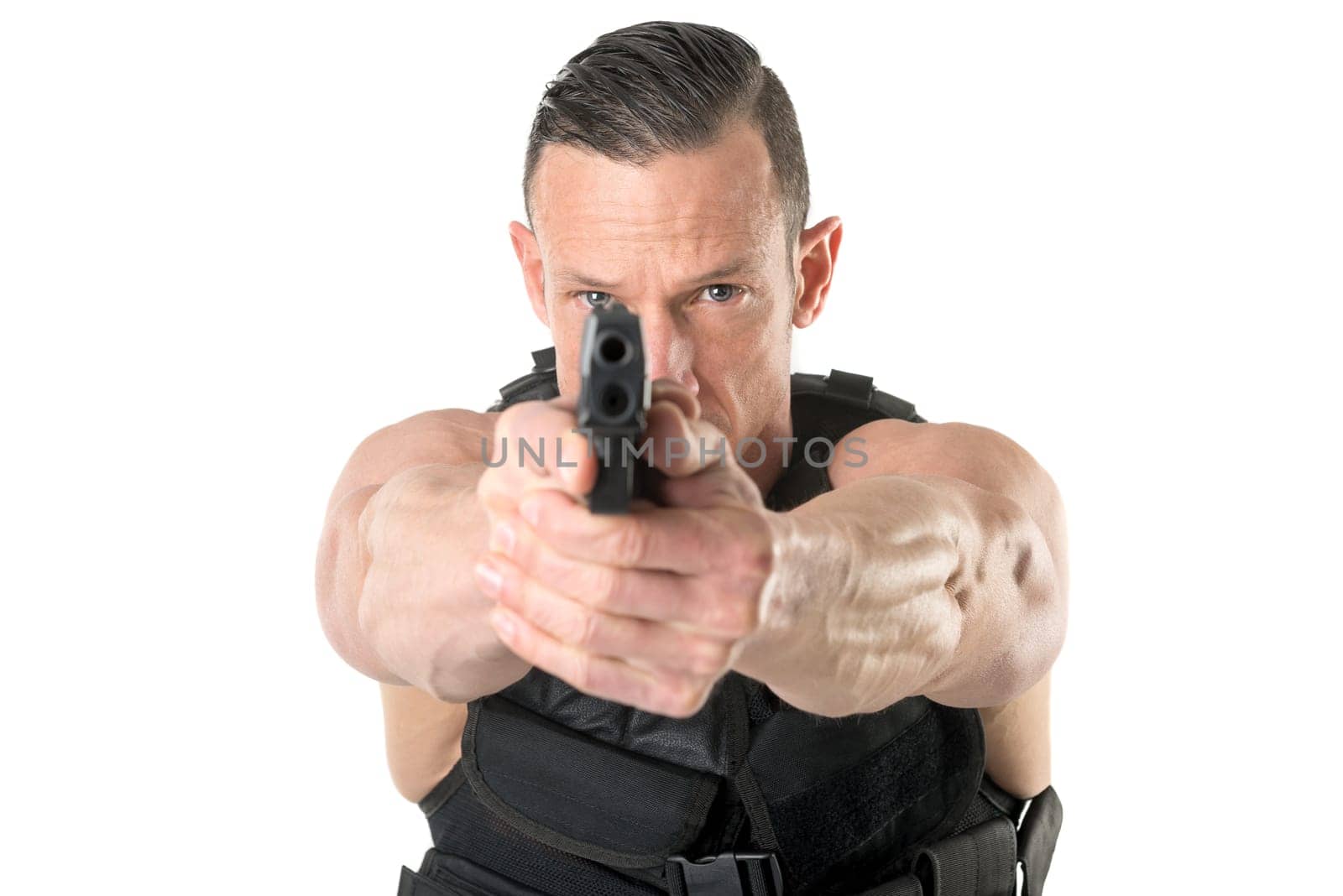 Man with tactical vest and gun isolated in white