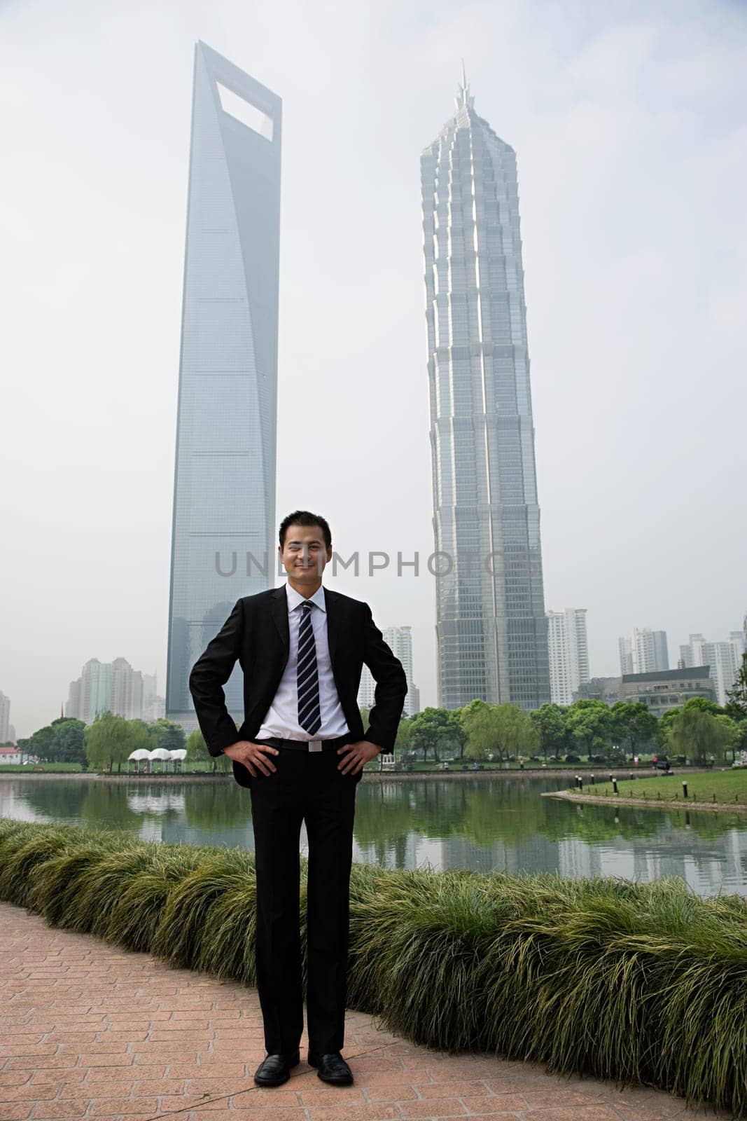 Chinese businessman near skyscrapers