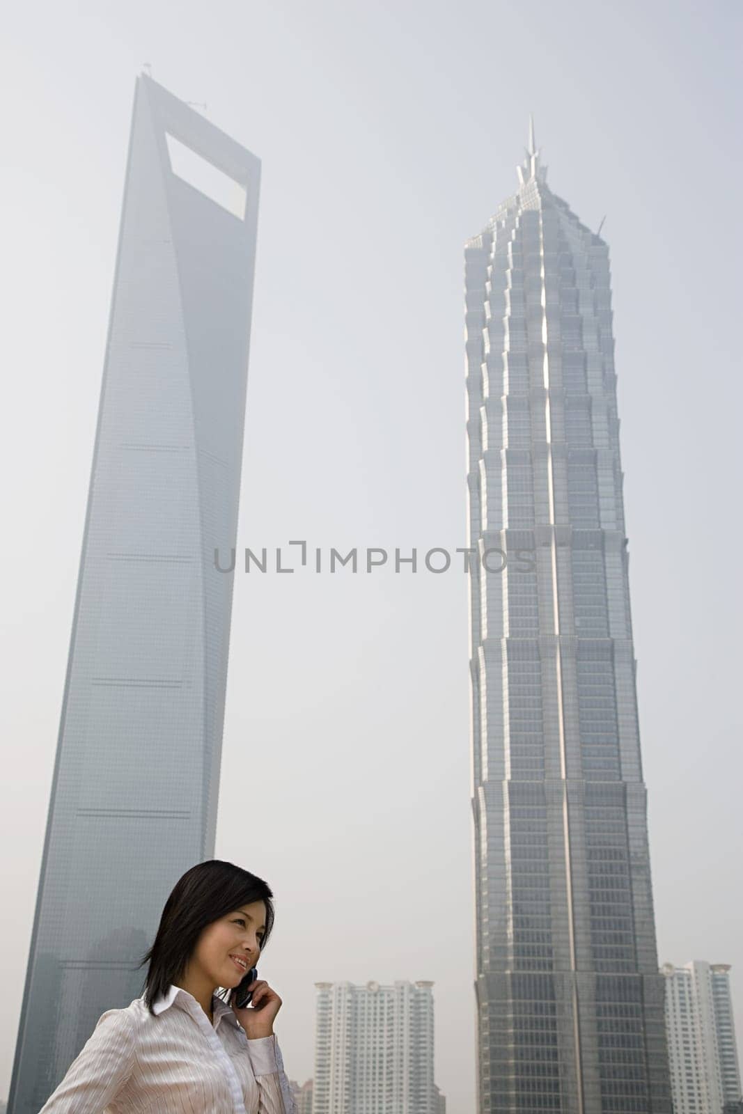 Chinese businesswoman near skyscrapers