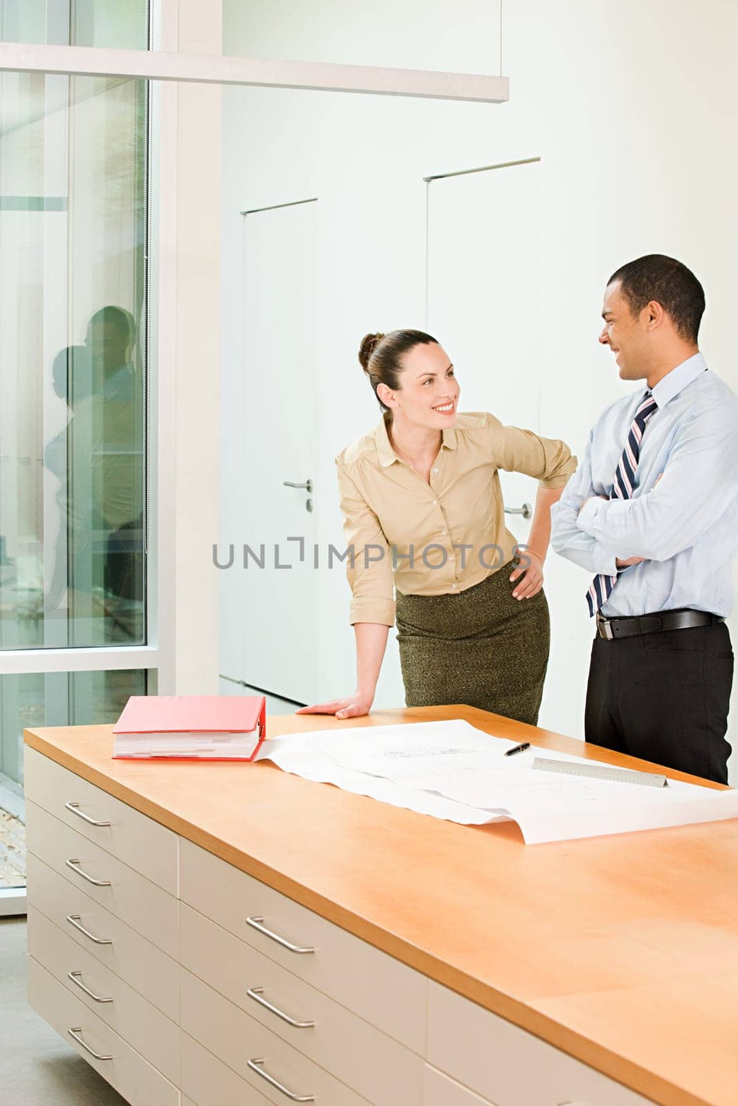 Two business colleagues talking