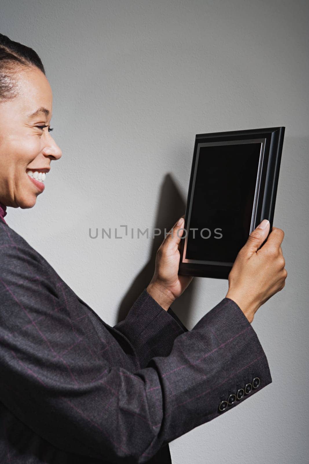 Business woman holding an award