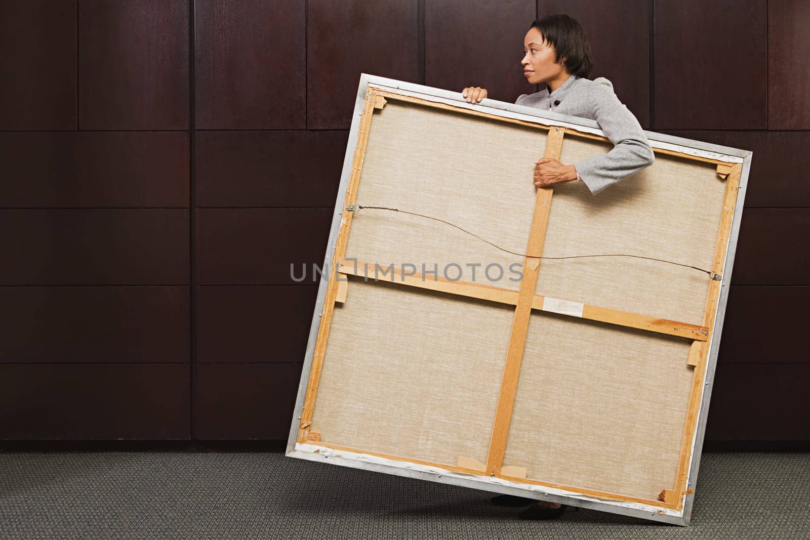 Business woman carrying canvas