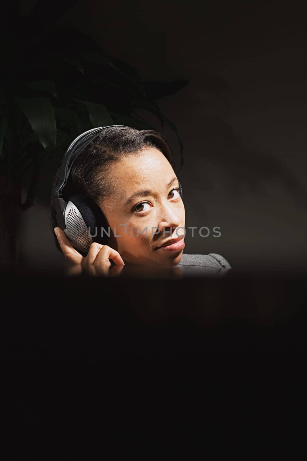 Business woman wearing headphones