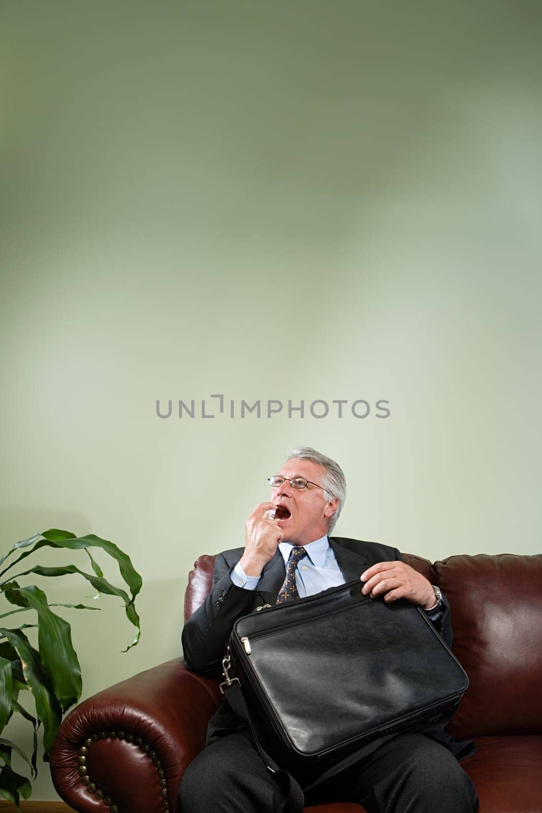 Man using breath freshener