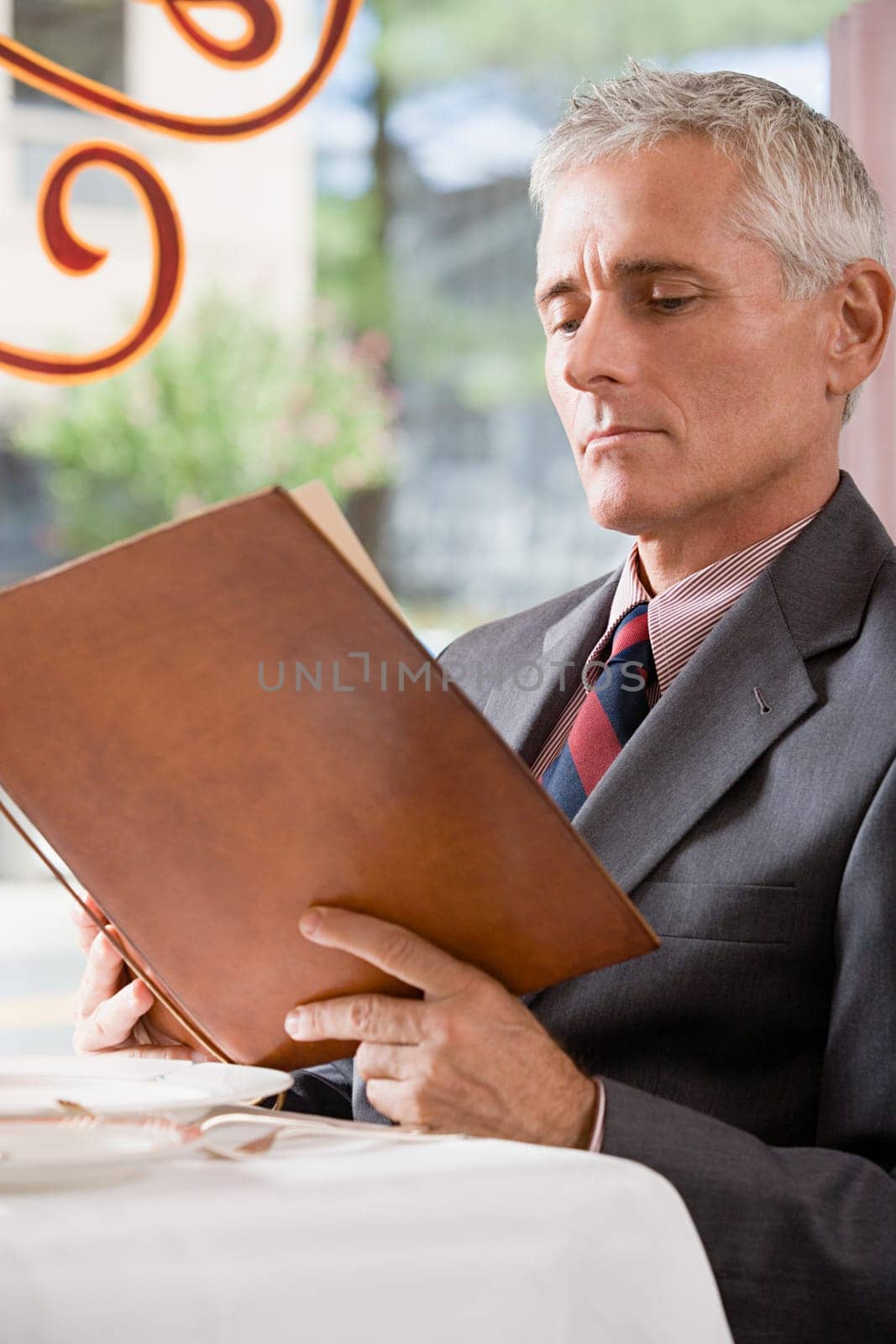Man looking at a menu
