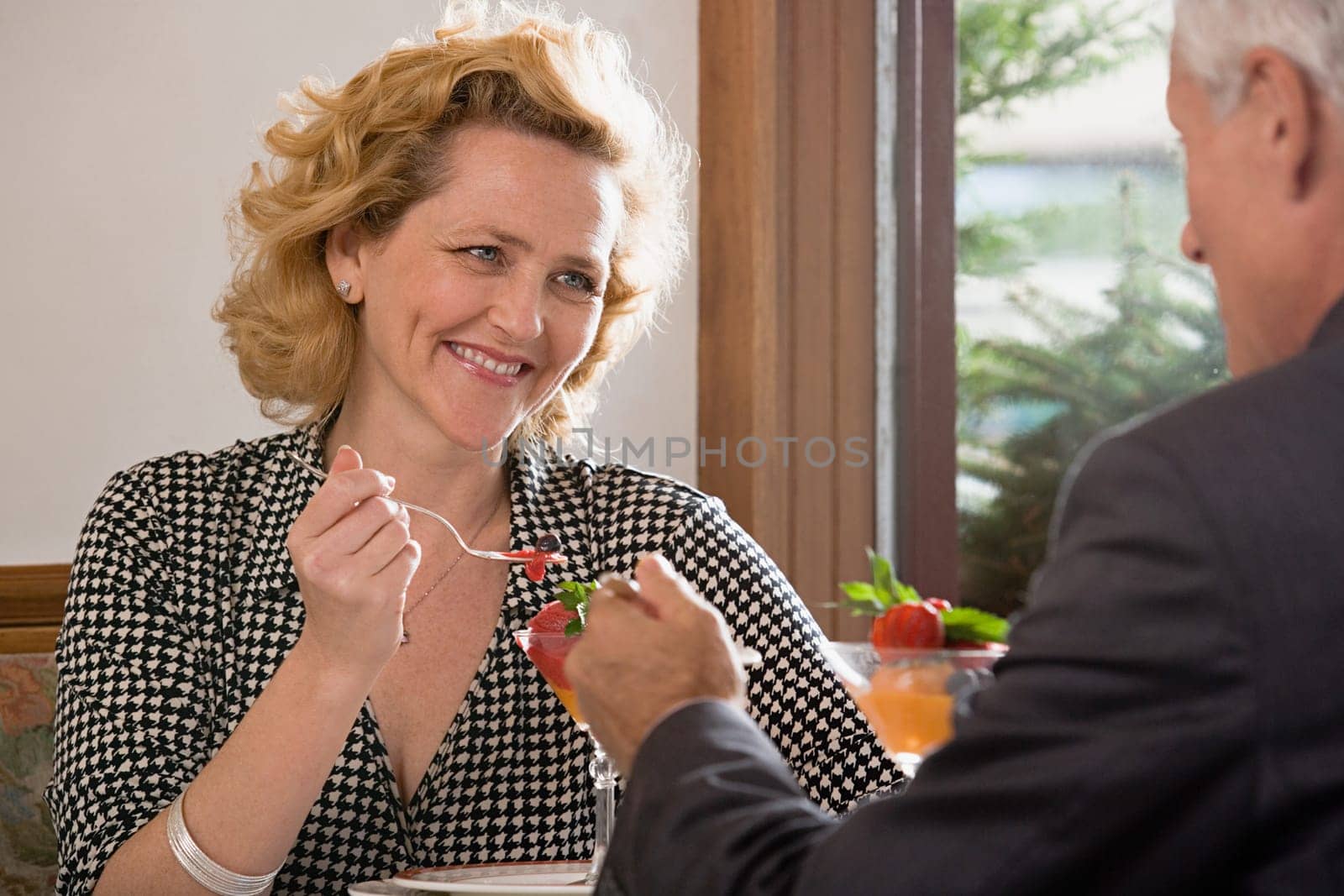 Woman and man having dessert