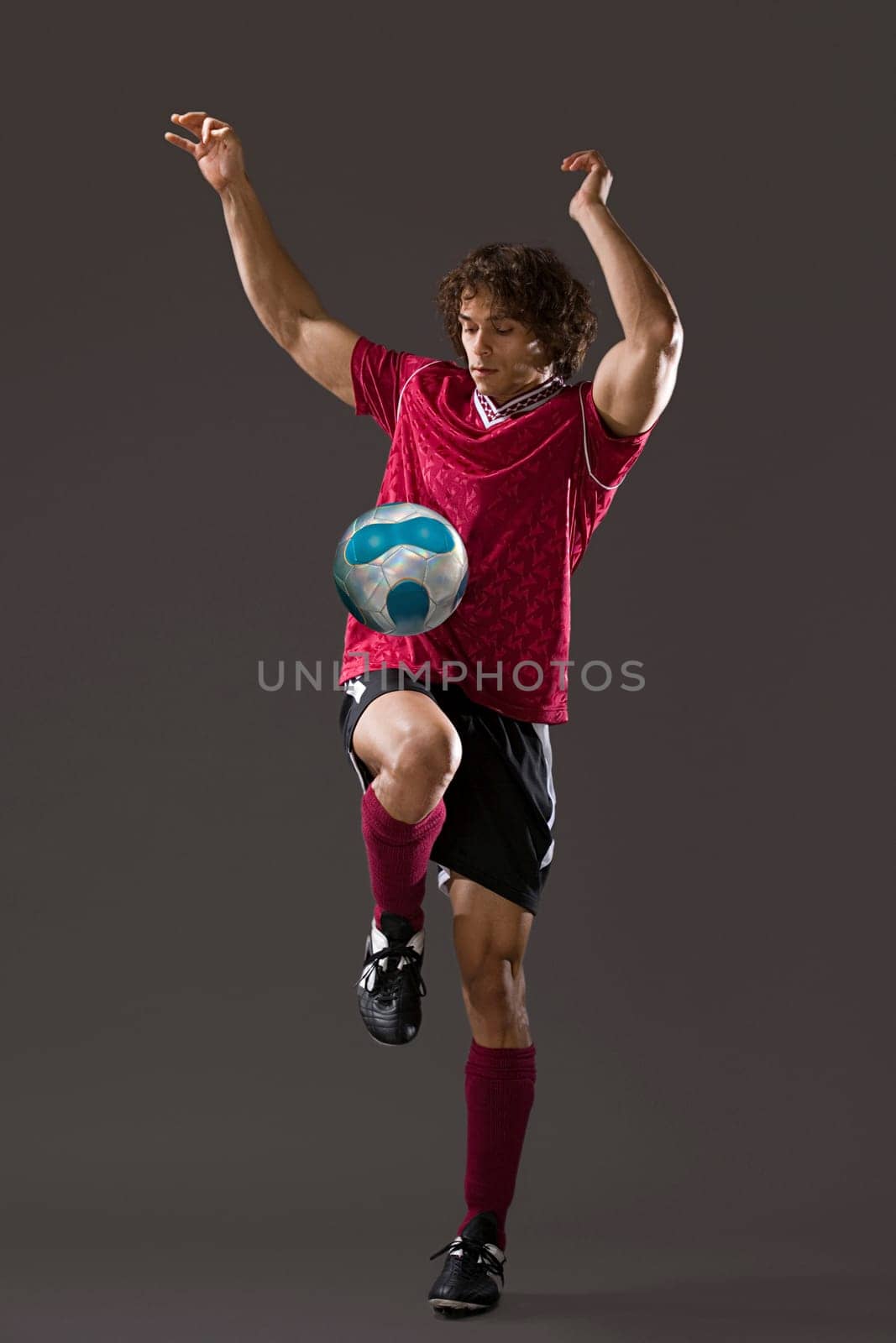 Footballer playing keepy uppy