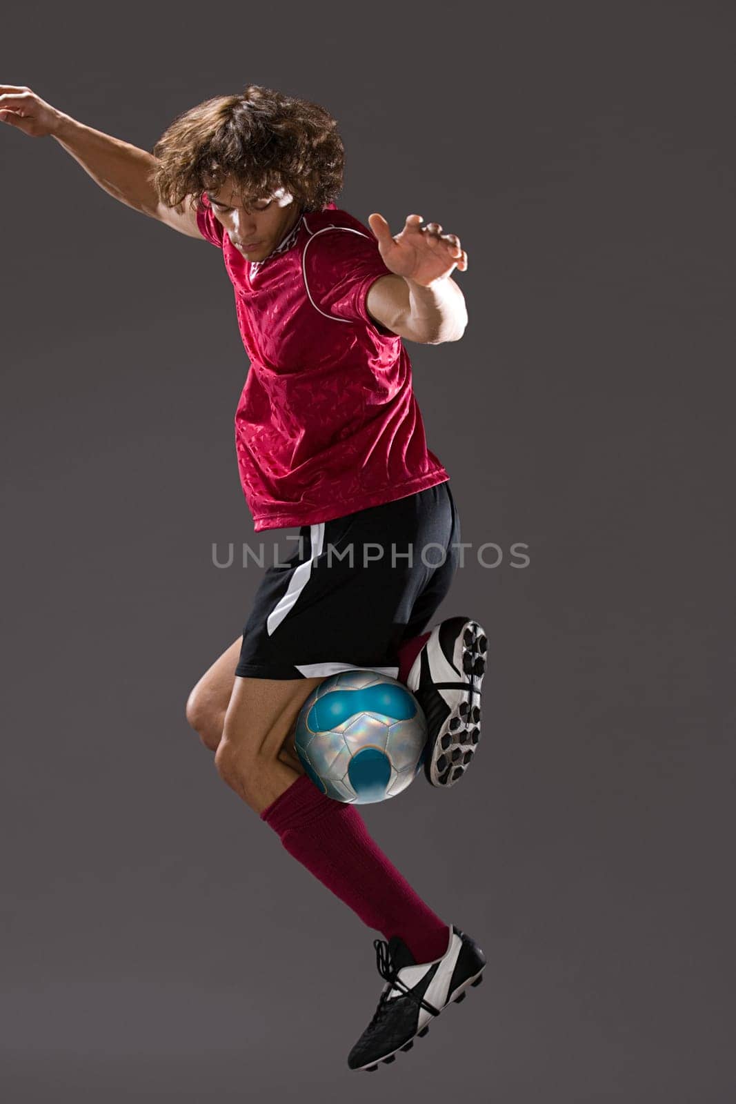 Footballer playing with ball