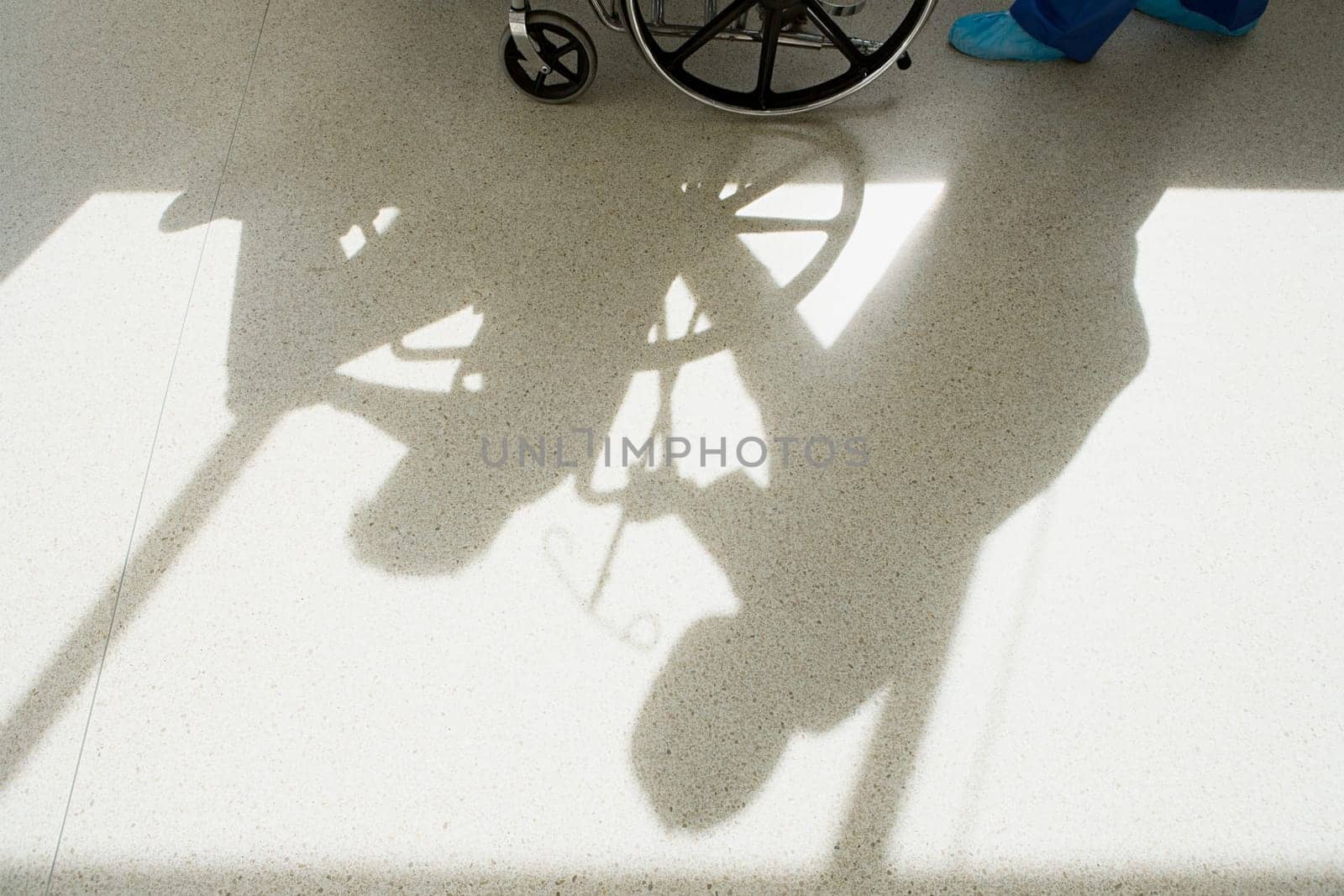 Nurse pushing patient in wheelchair