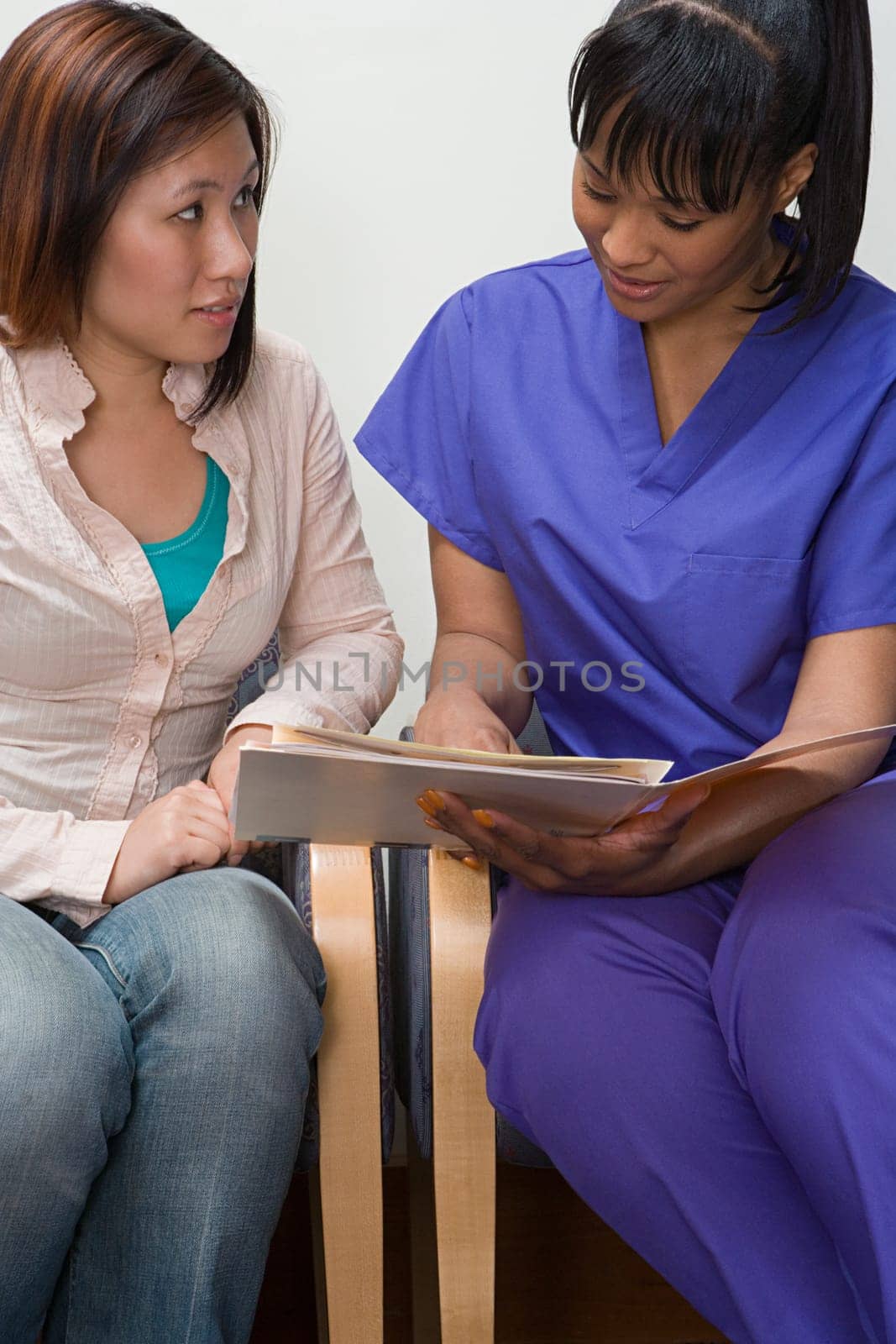 Nurse sharing information with patient