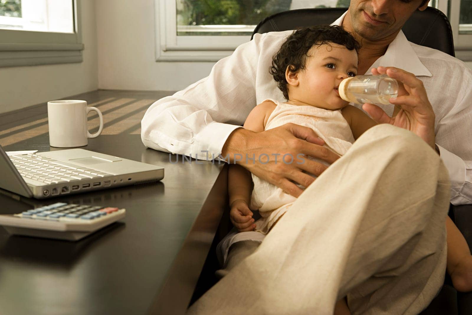 Man feeding baby