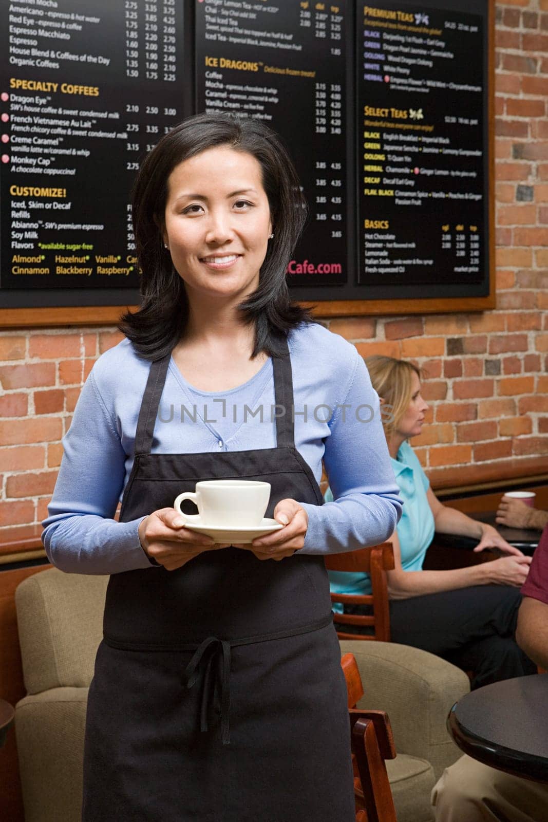 Waiter holding coffee cup
