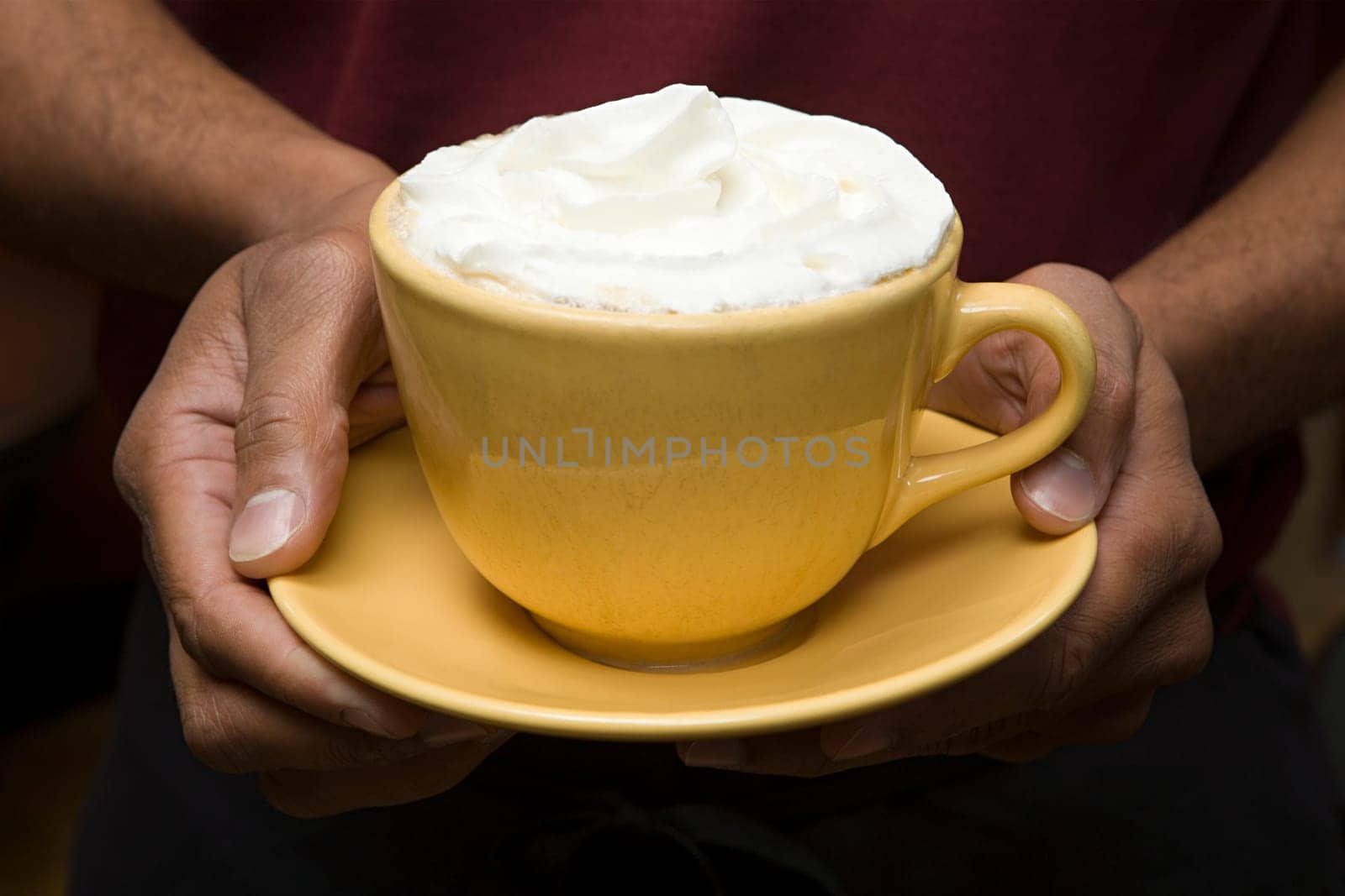 Person holding hot chocolate