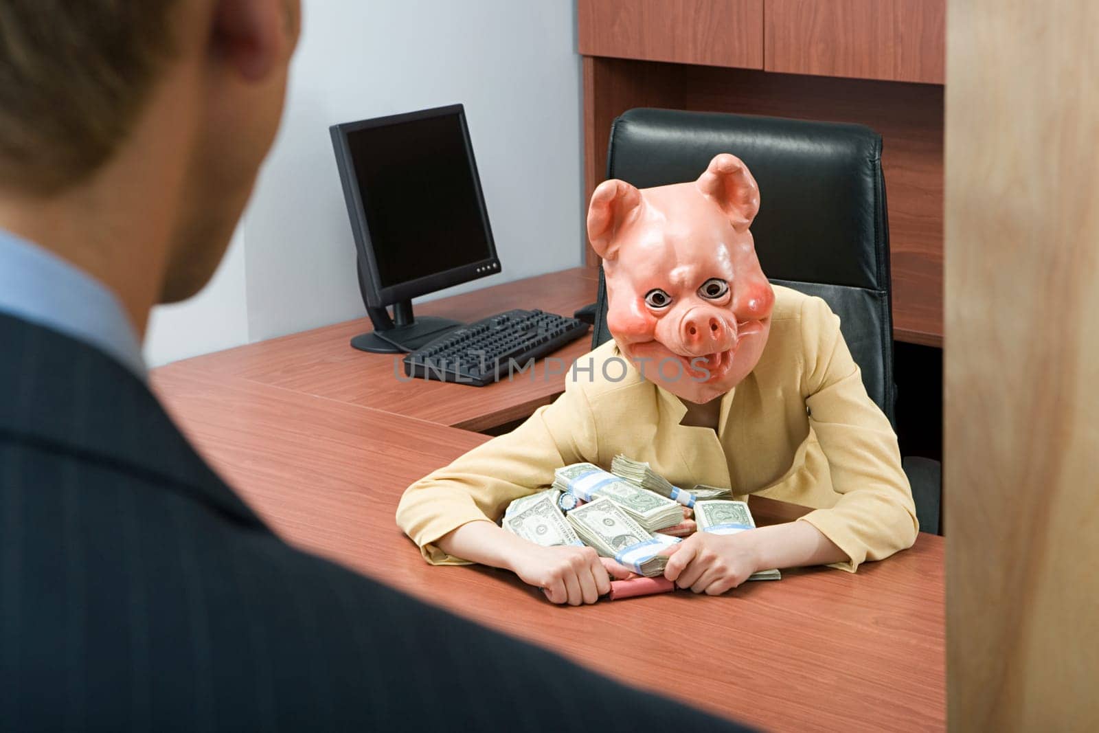 Businesswoman in pig mask holding money
