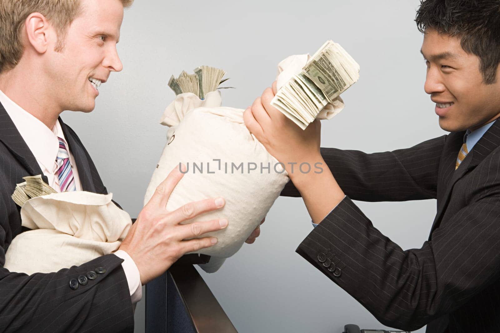 Businessmen passing money