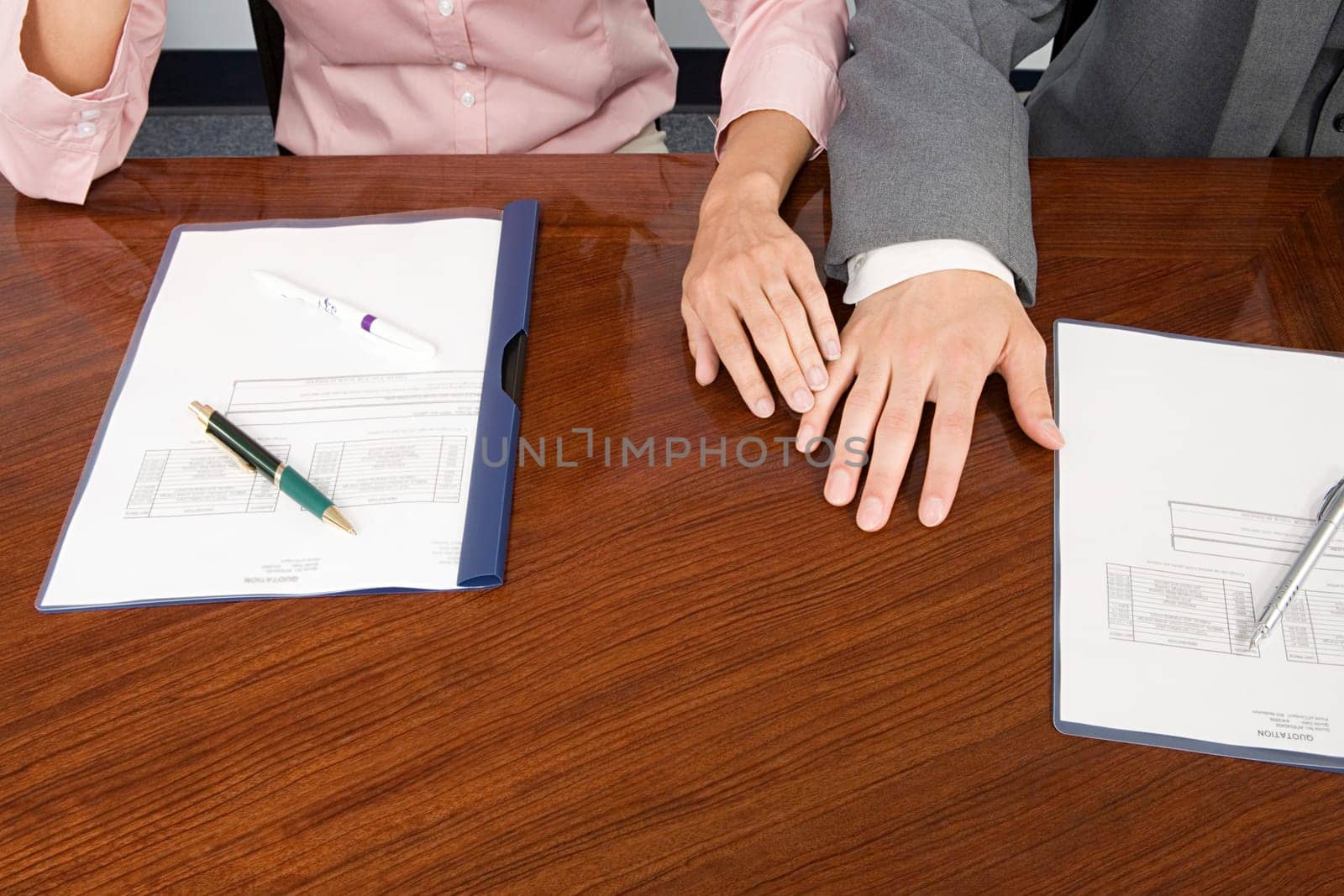 Colleagues hands touching