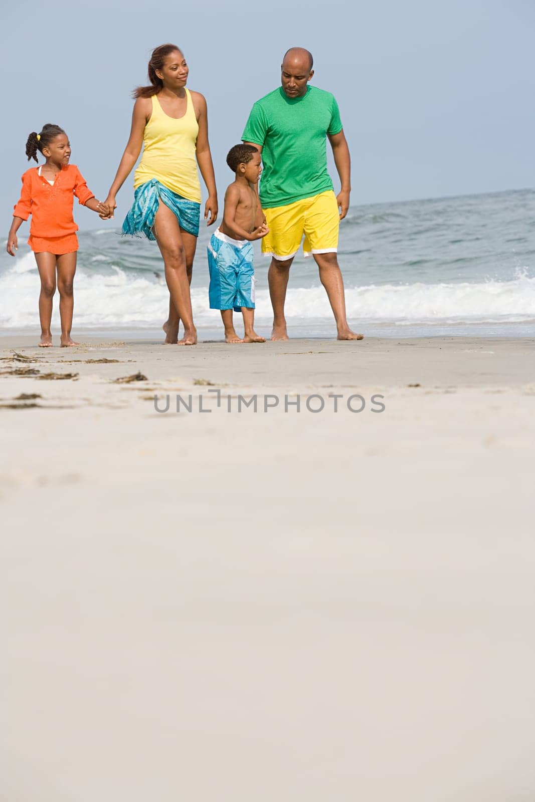 Family walking along a beach
