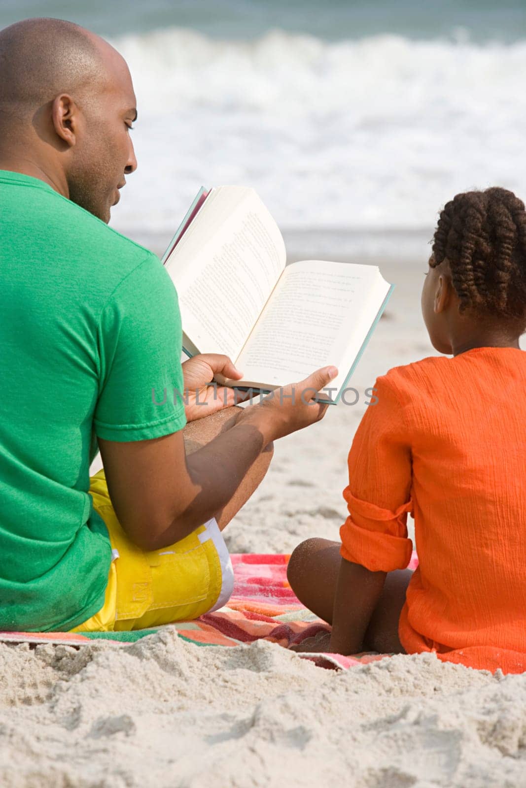 Father and daughter reading a book