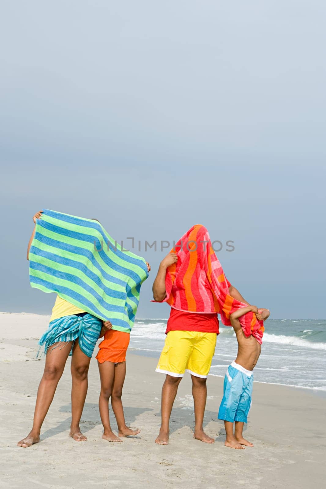 Family with towels over them