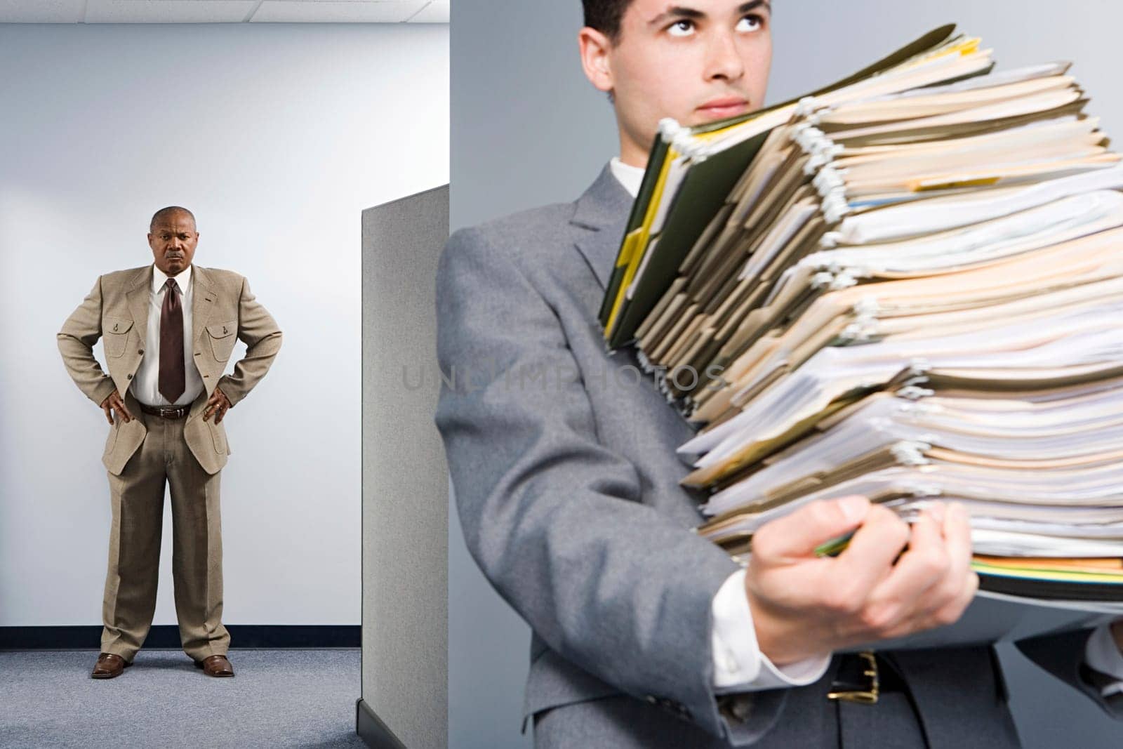 Businessman carrying lots of files