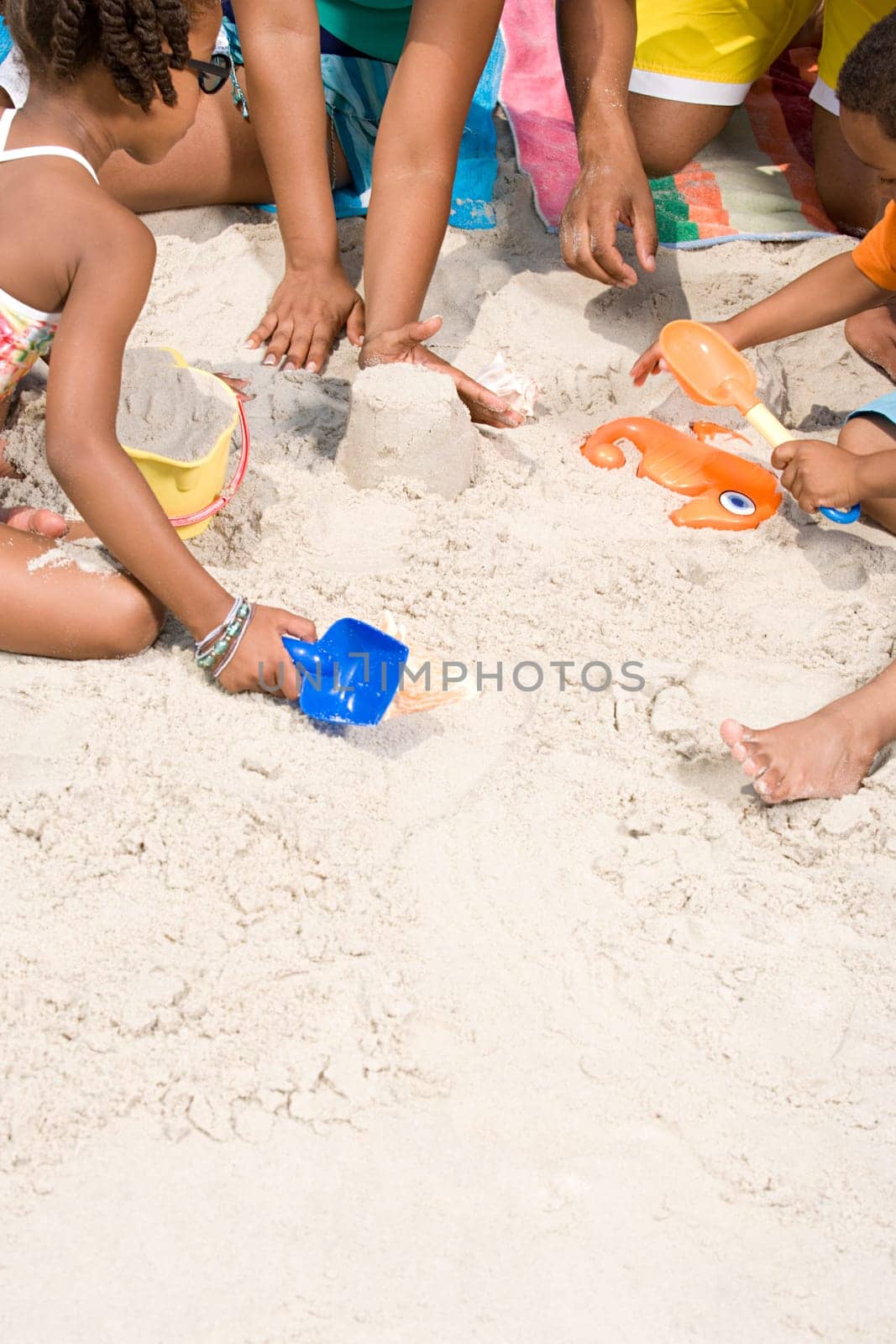 Family making sandcastles