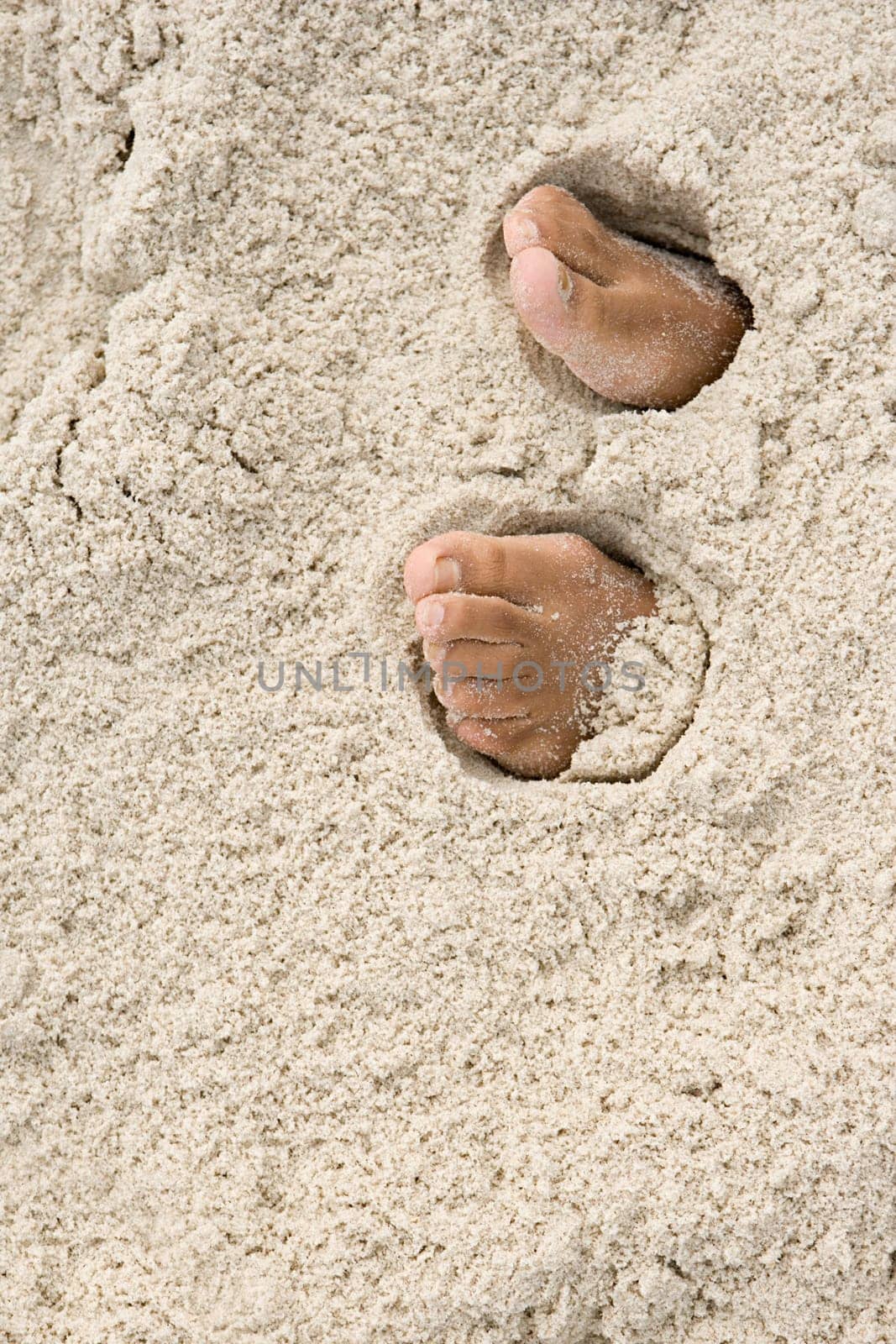 Feet under sand