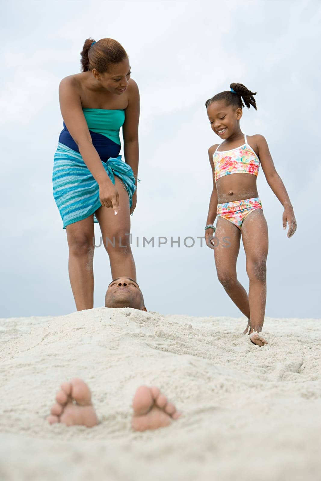 Father buried in the sand