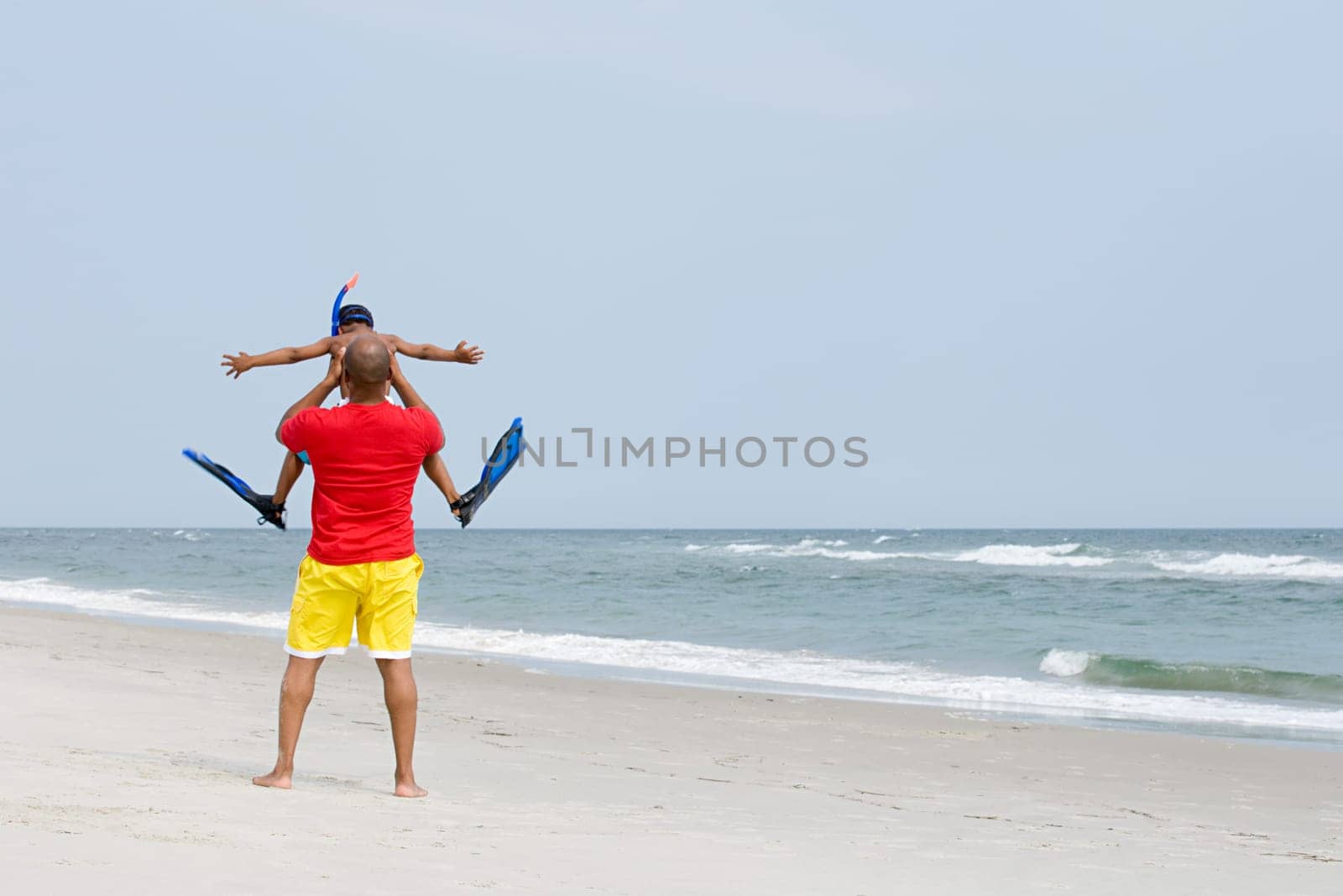 Father lifting son