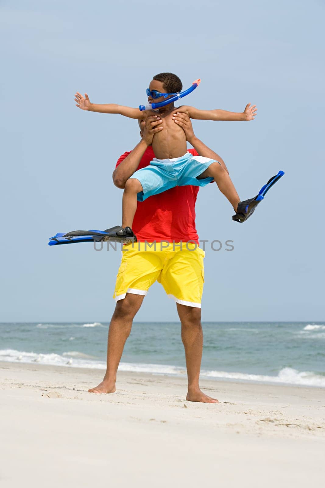 Father lifting son