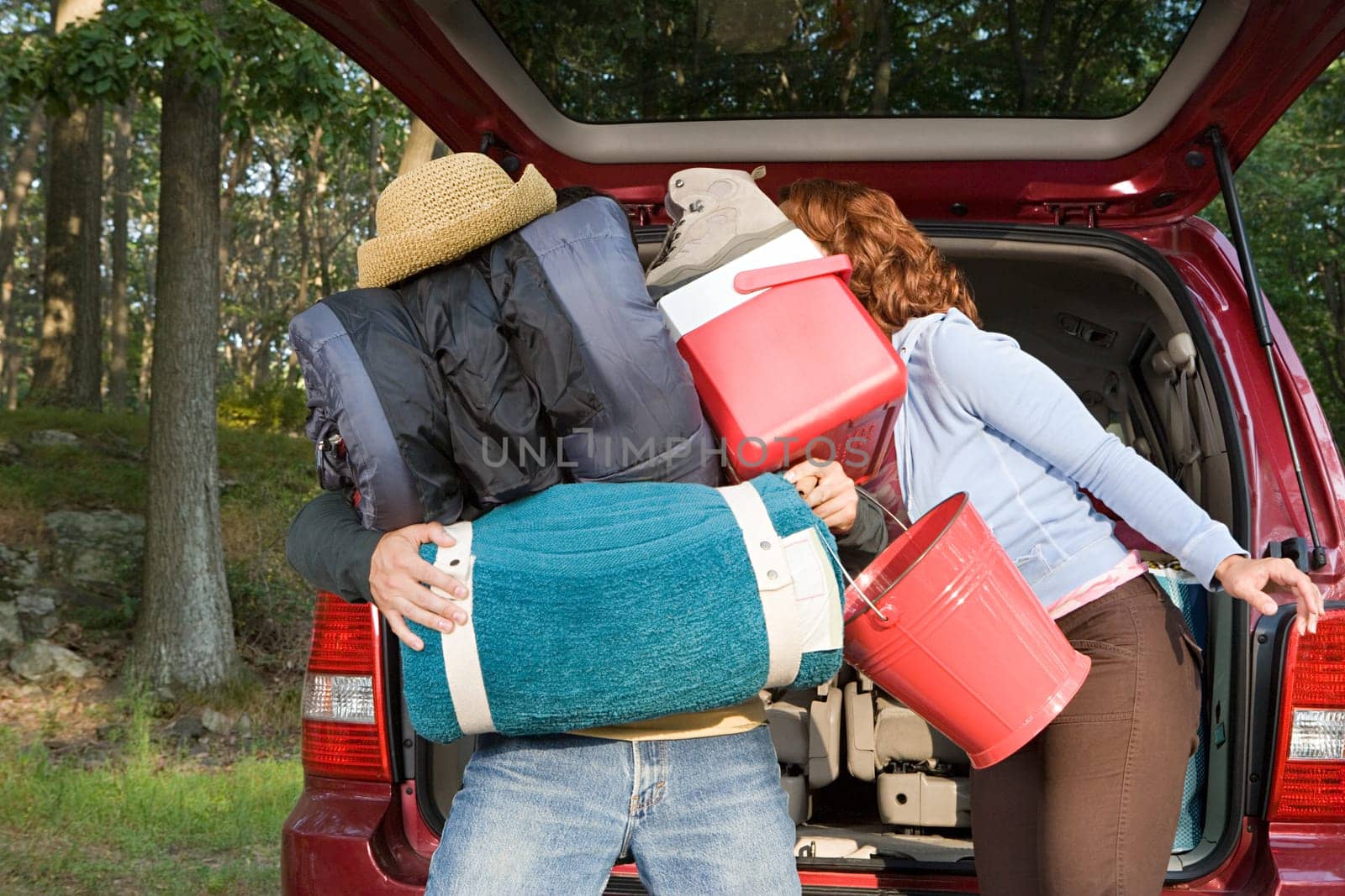 Couple unpacking car
