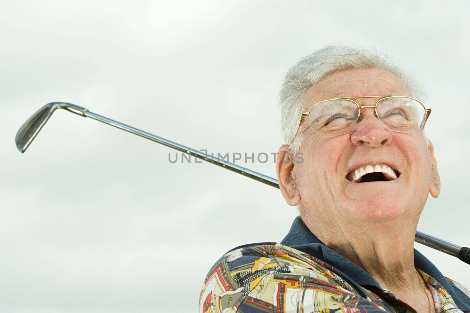 Senior man playing golf