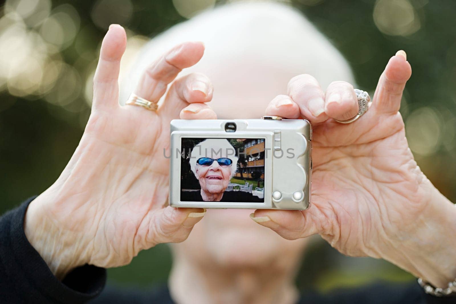 Senior woman taking a self portrait photograph