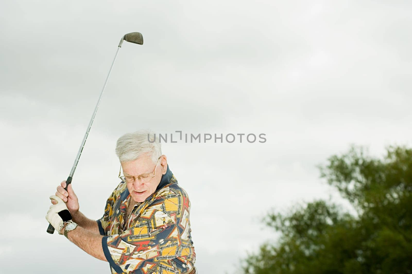 Senior man playing golf