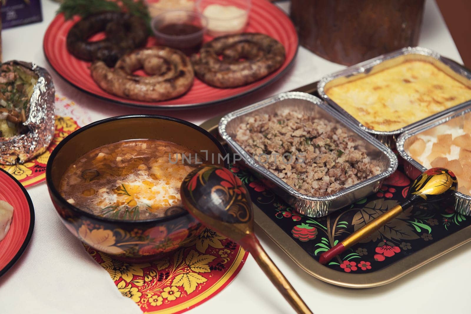 Table with traditional russian food decorated in russian style