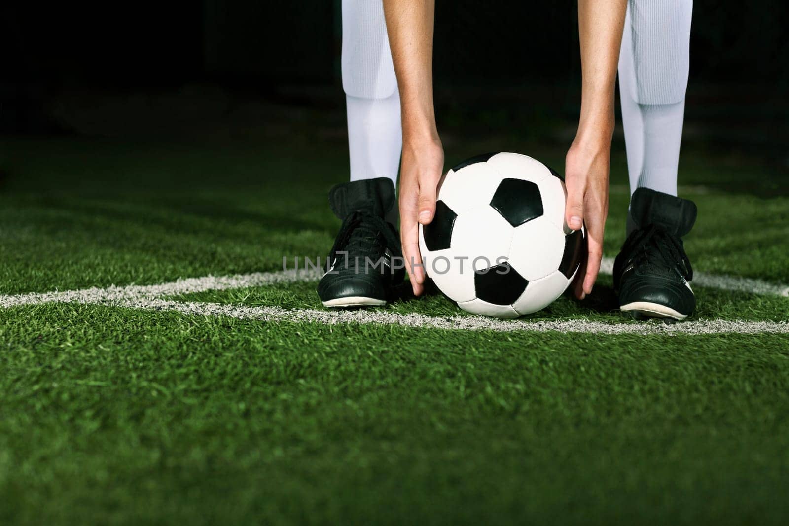 Athlete placing soccer ball for corner kick