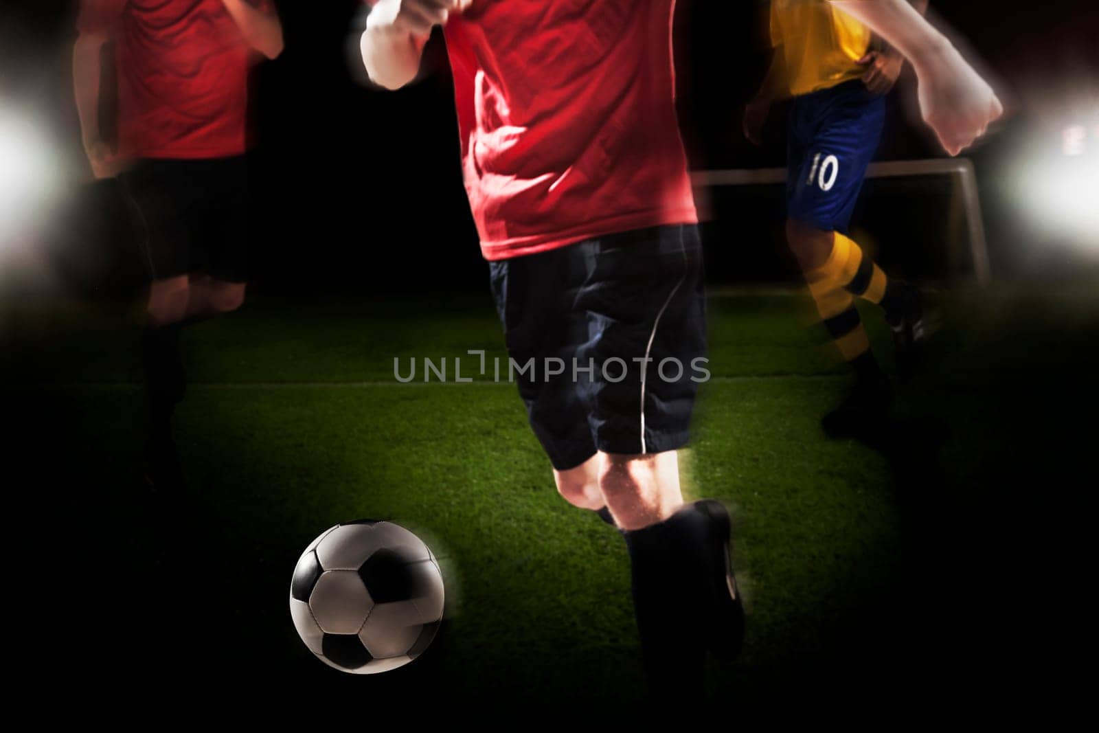 Soccer player kicking soccer ball