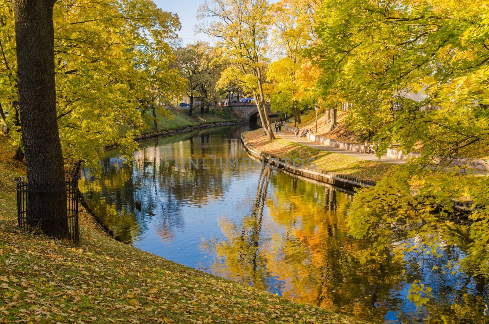 Beautiful autumn park at the channel in Riga