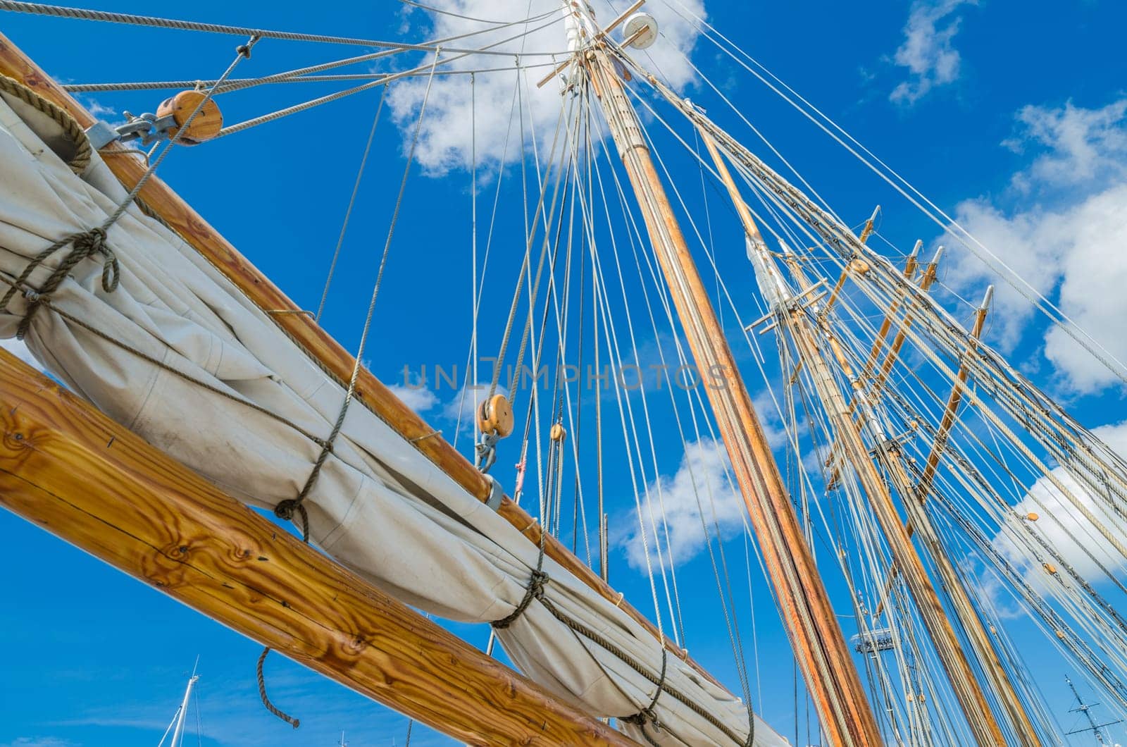 Folded sail and mast on an old sailboat