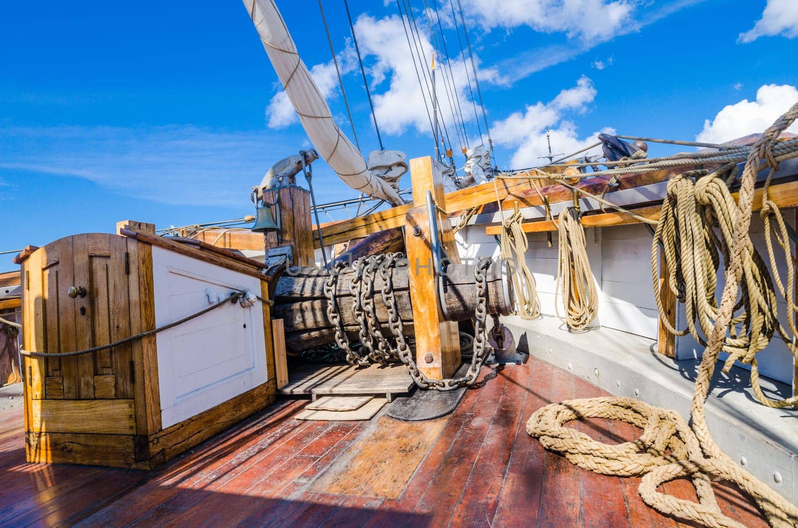 The ship's bell and the anchor lift mechanism on the sailboat
