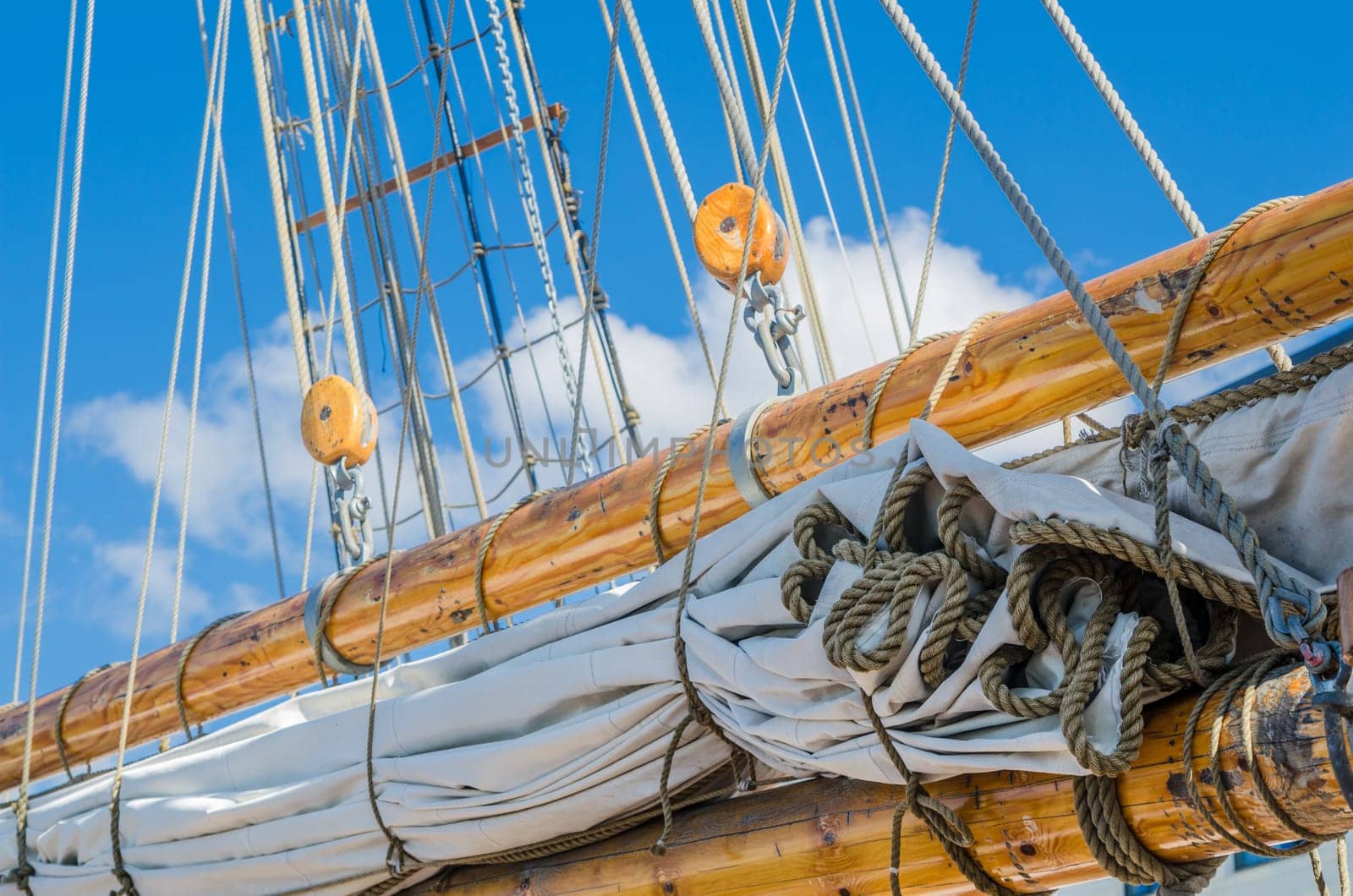 Folded sail and mast on an old sailboat
