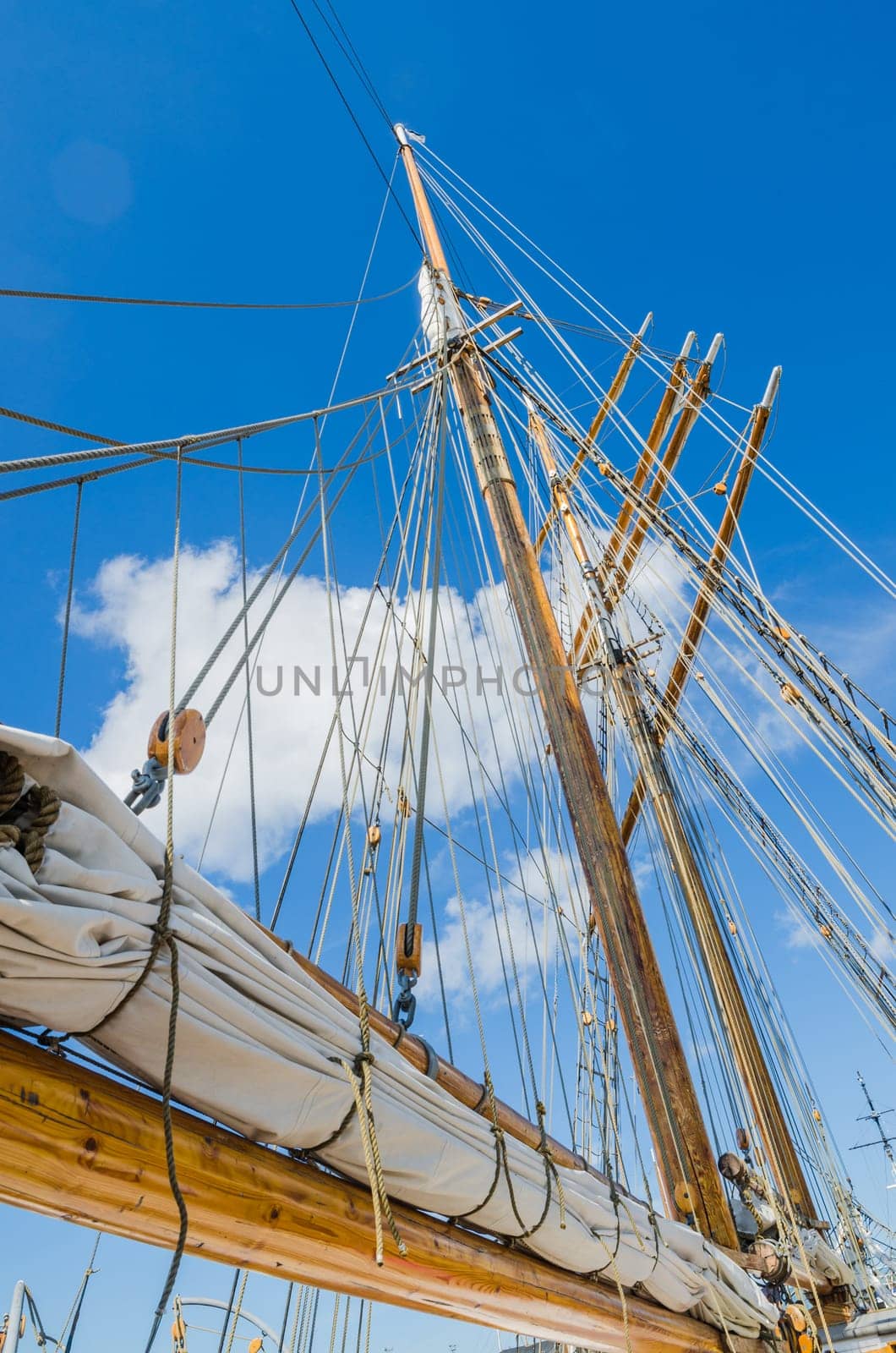 Folded sail and mast on an old sailboat