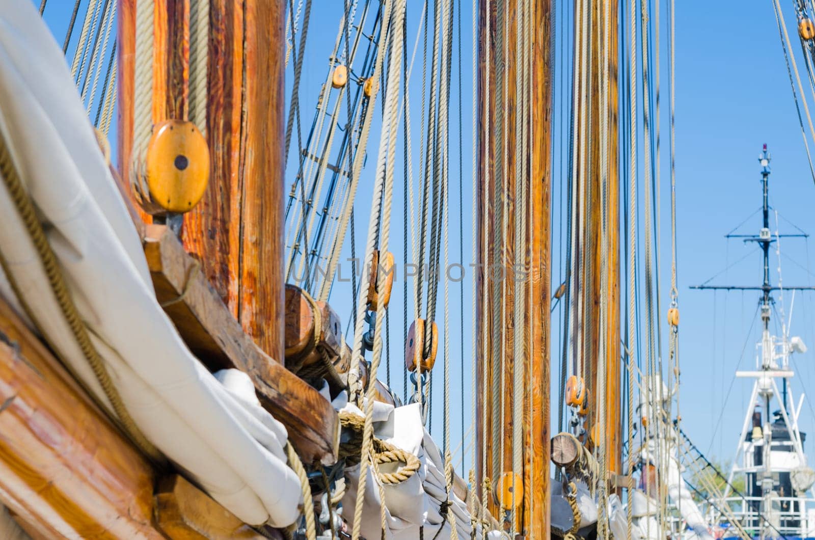 Folded sail and mast on an old sailboat