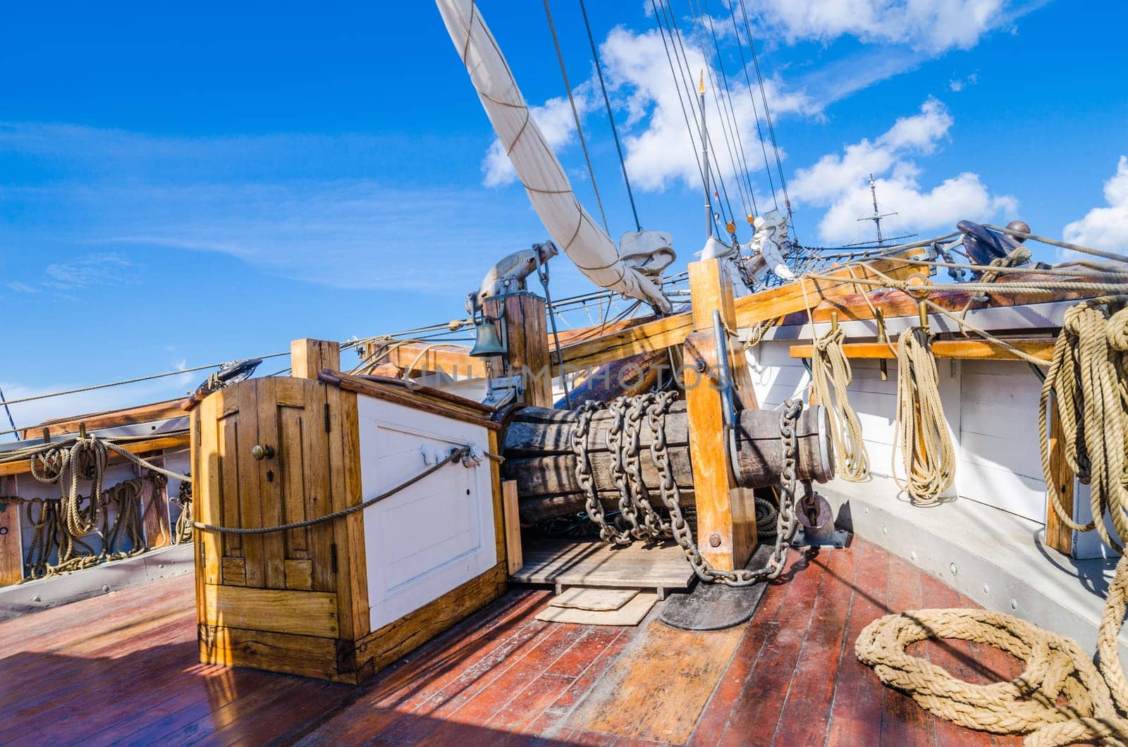 The ship's bell and the anchor lift mechanism on the sailboat