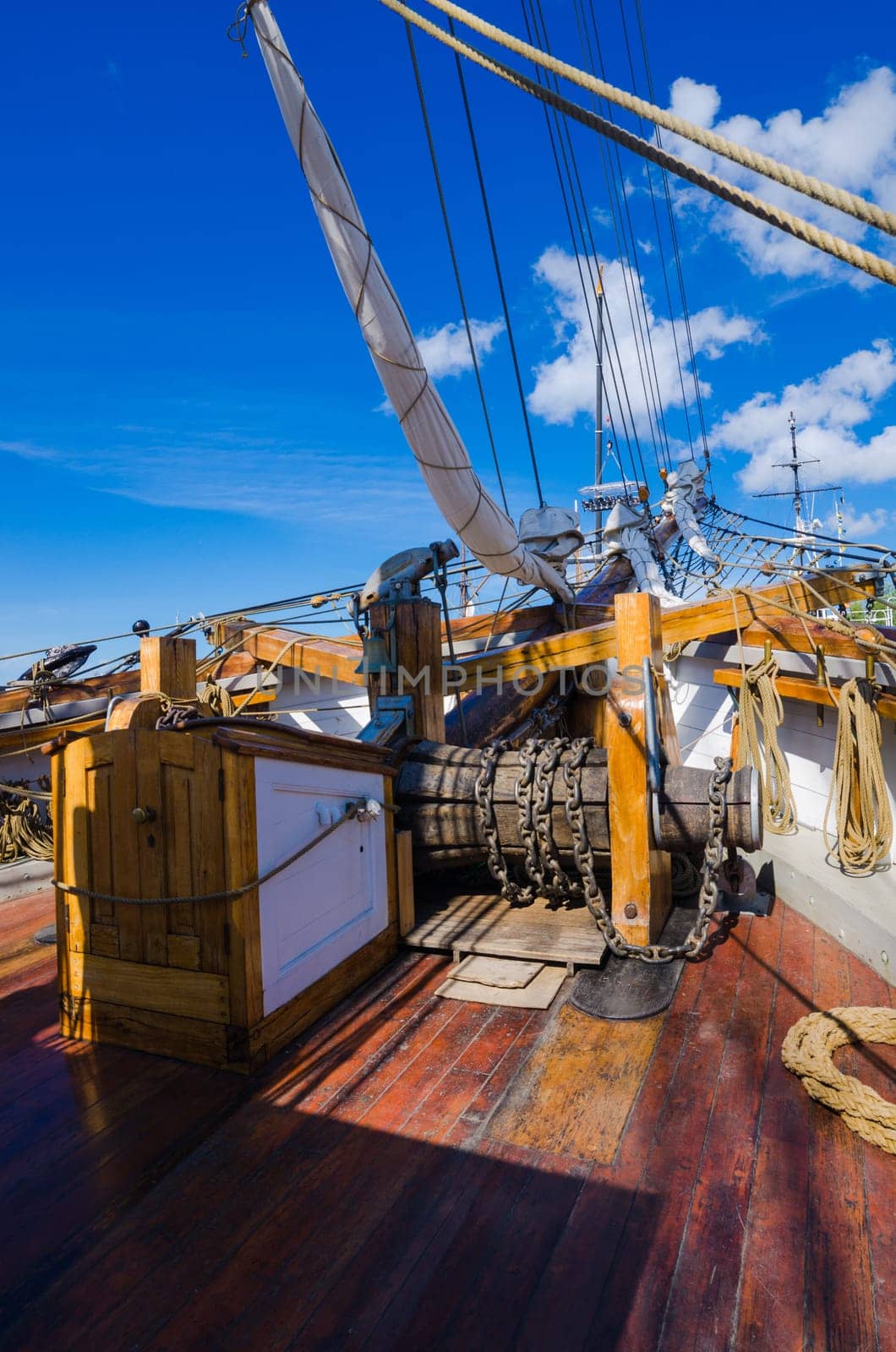 The ship's bell and the anchor lift mechanism on the sailboat
