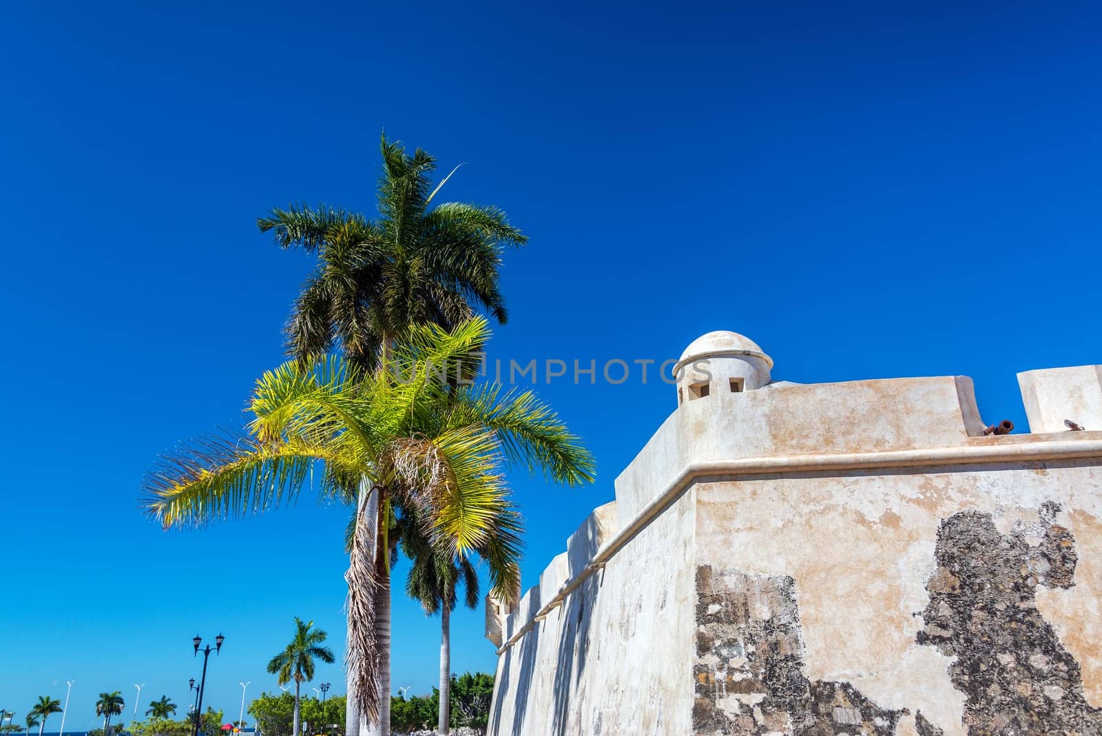 View of the colonial defensive wall and palm trees in Campeche, Mexico