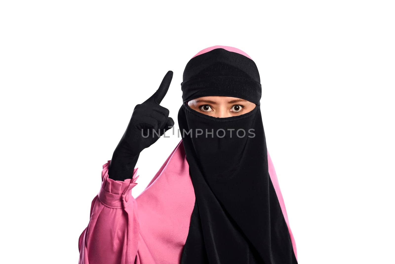 Close up asian muslim woman in hijab pointing with angry eyes isolated over white background