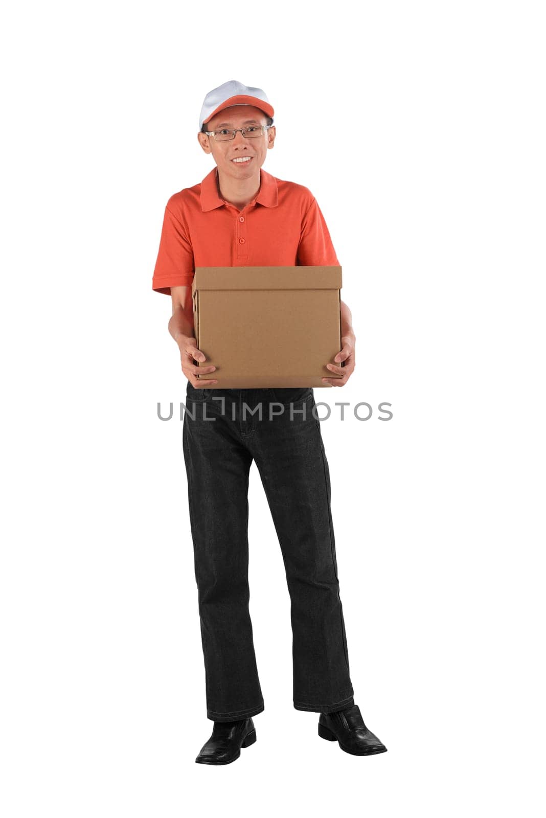 Young asian courier holding a cardboard box while standing isolated against white background