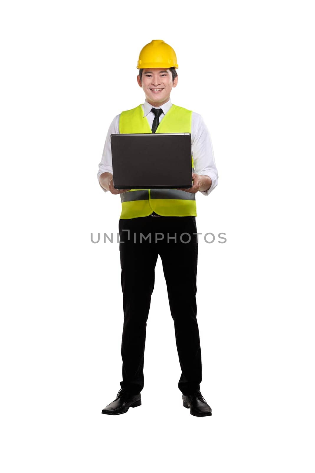 Smiling asian construction man with worker uniform holding laptop isolated over white background