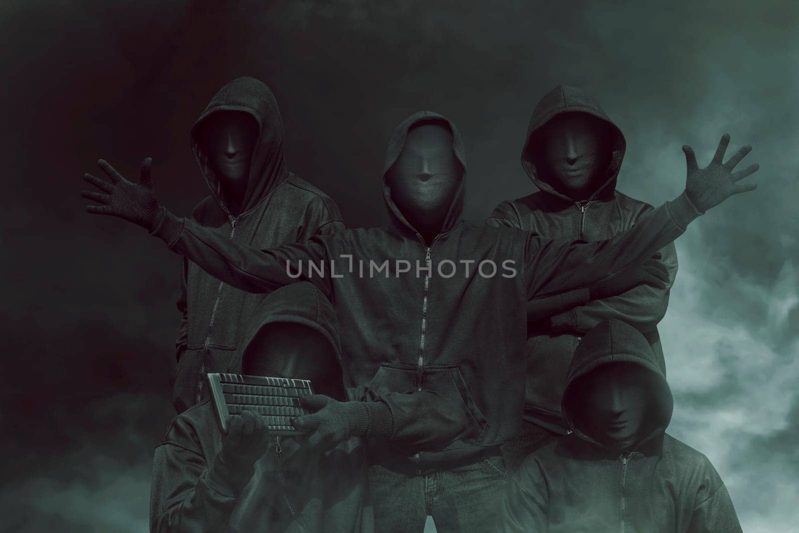Group of hacker with mask in hoodies against dark background